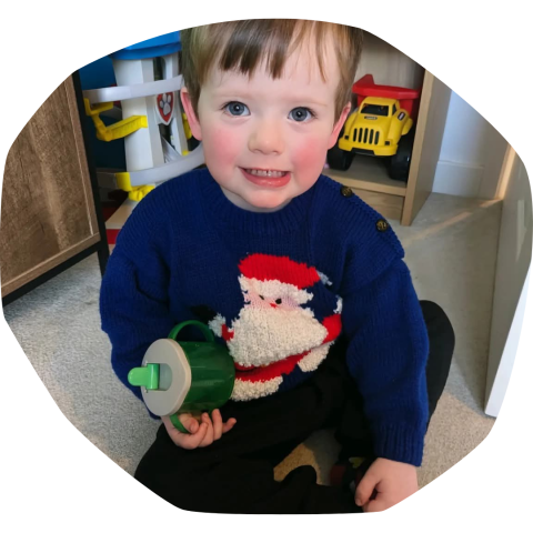 Rufus, who has CF, wearing a Christmas jumper