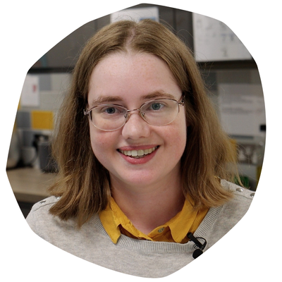 Sarah, a young woman with short brown hair and glasses, who has CF