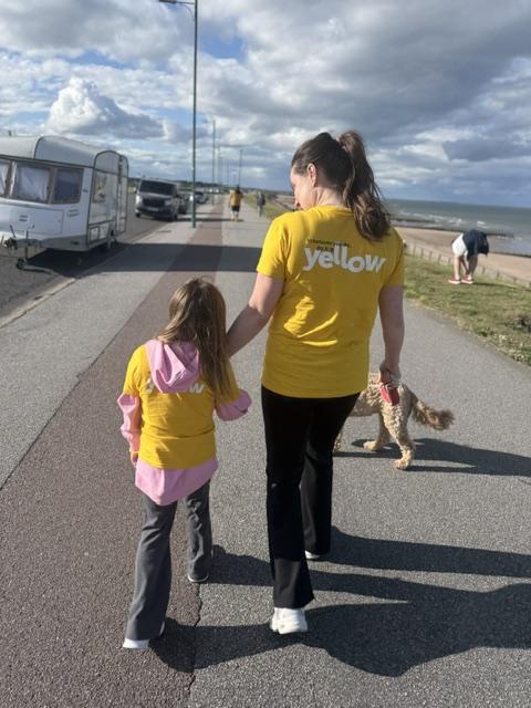 Piper and Kerry hold hands while completing their 5k Your Way challenge
