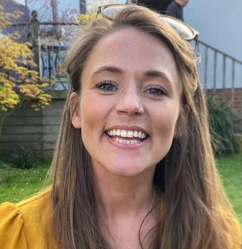 Photo of Laura outside smiling into the camera
