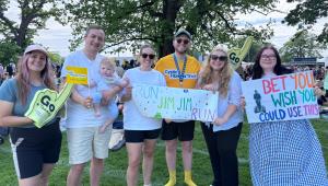 a group of people holding motivational running signs
